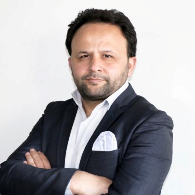 A professional portrait of Dr. Selami Balcı.